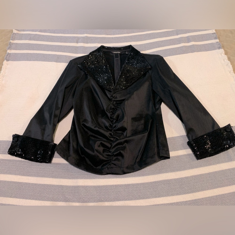 Women’s beaded, fitted shirt. Zippered in back. Beautiful condition.